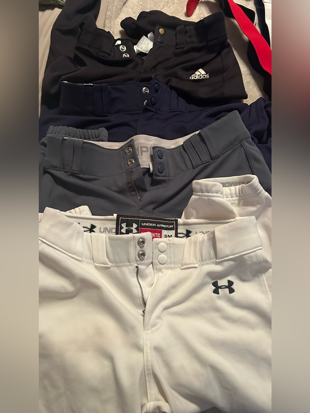Softball bundle!!!! Pants socks belts and a headband Sizes of pants in pictures